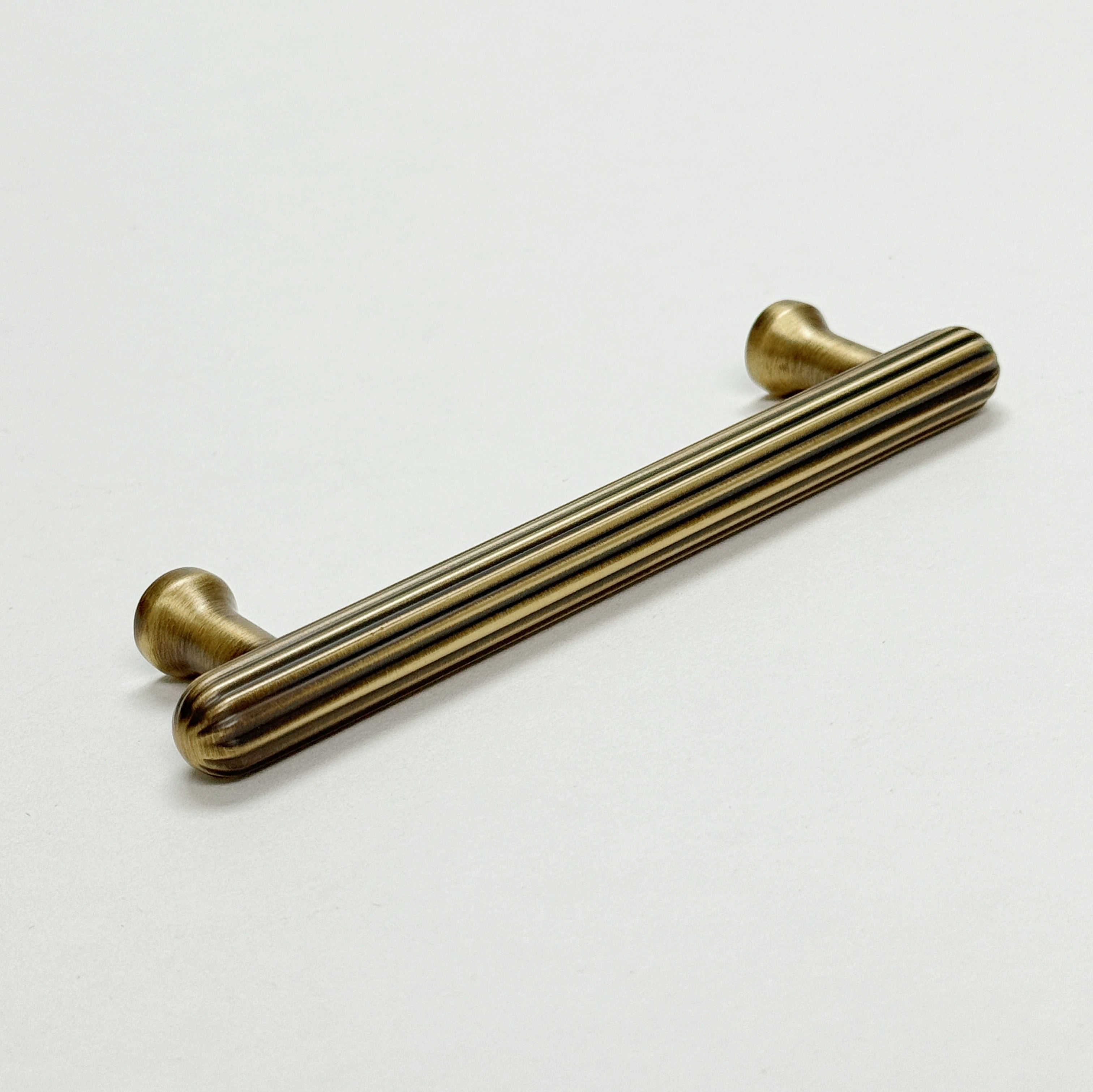 Fluted Antique Brass "Jewel" Ridge Cabinet Knobs and Pulls - Industry Hardware